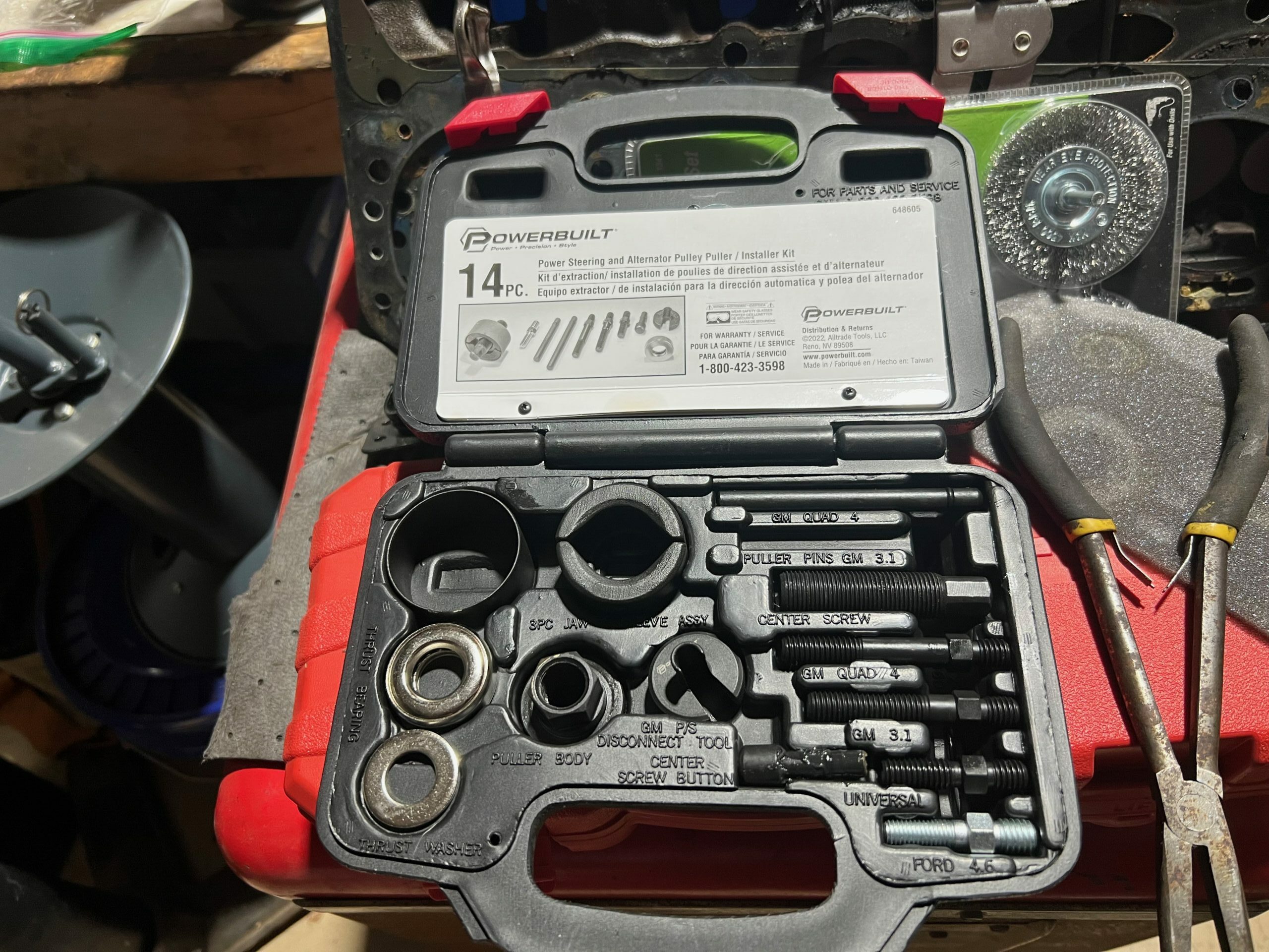 plastic molded box with tool parts and quasi instructions