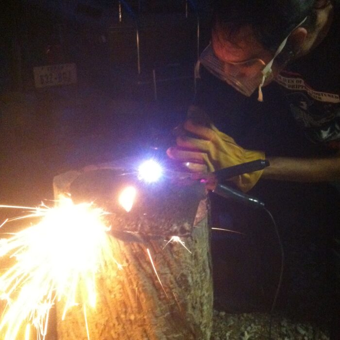 plasma cutter throwing sparks at night