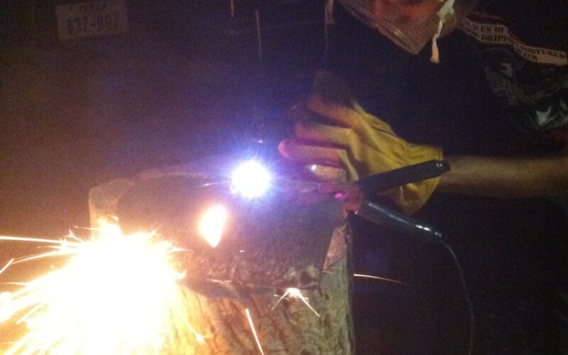 plasma cutter throwing sparks at night