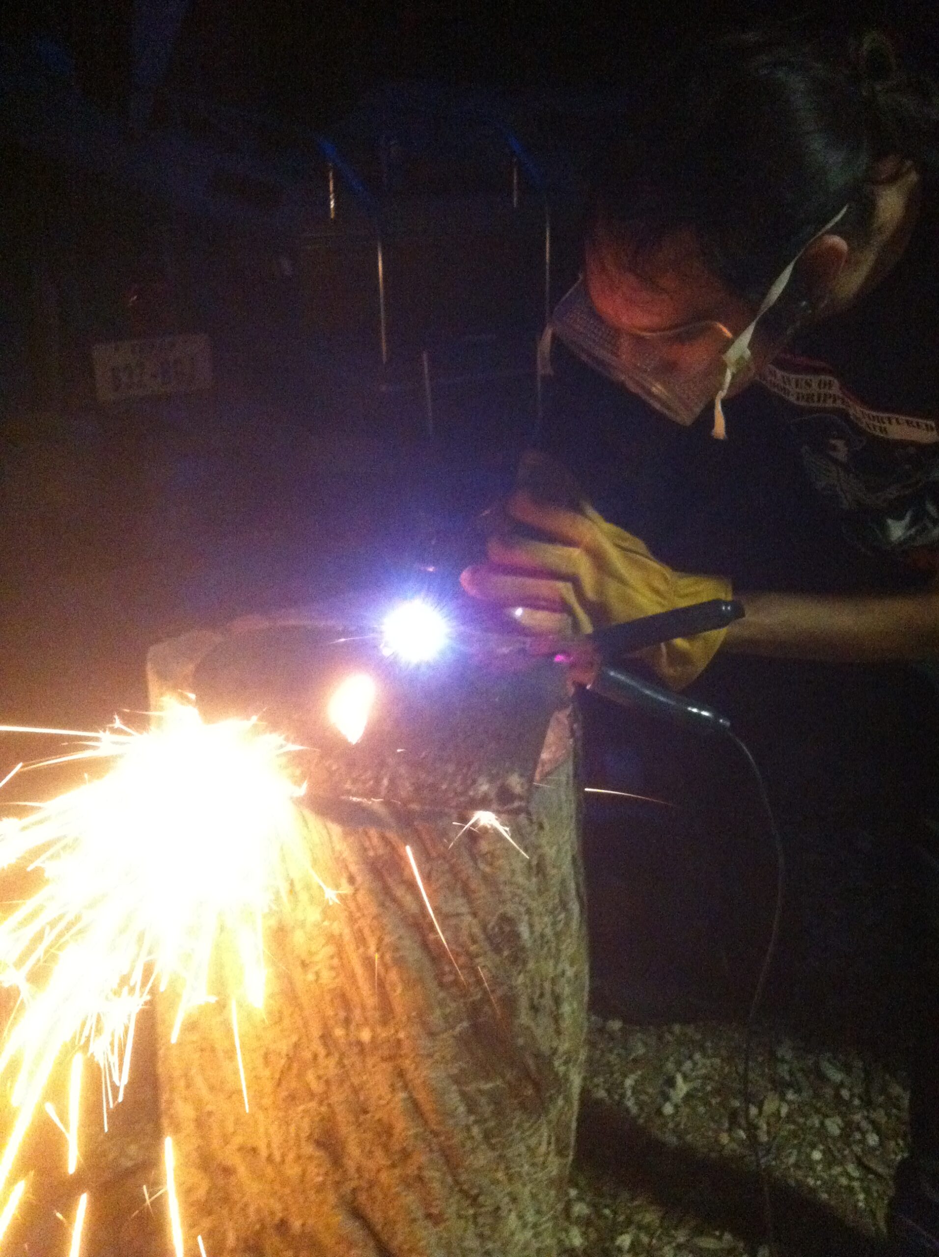 plasma cutter throwing sparks at night